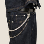 ICED London denim jeans with a black belt and silver chain accessory draped from belt loop to pocket.