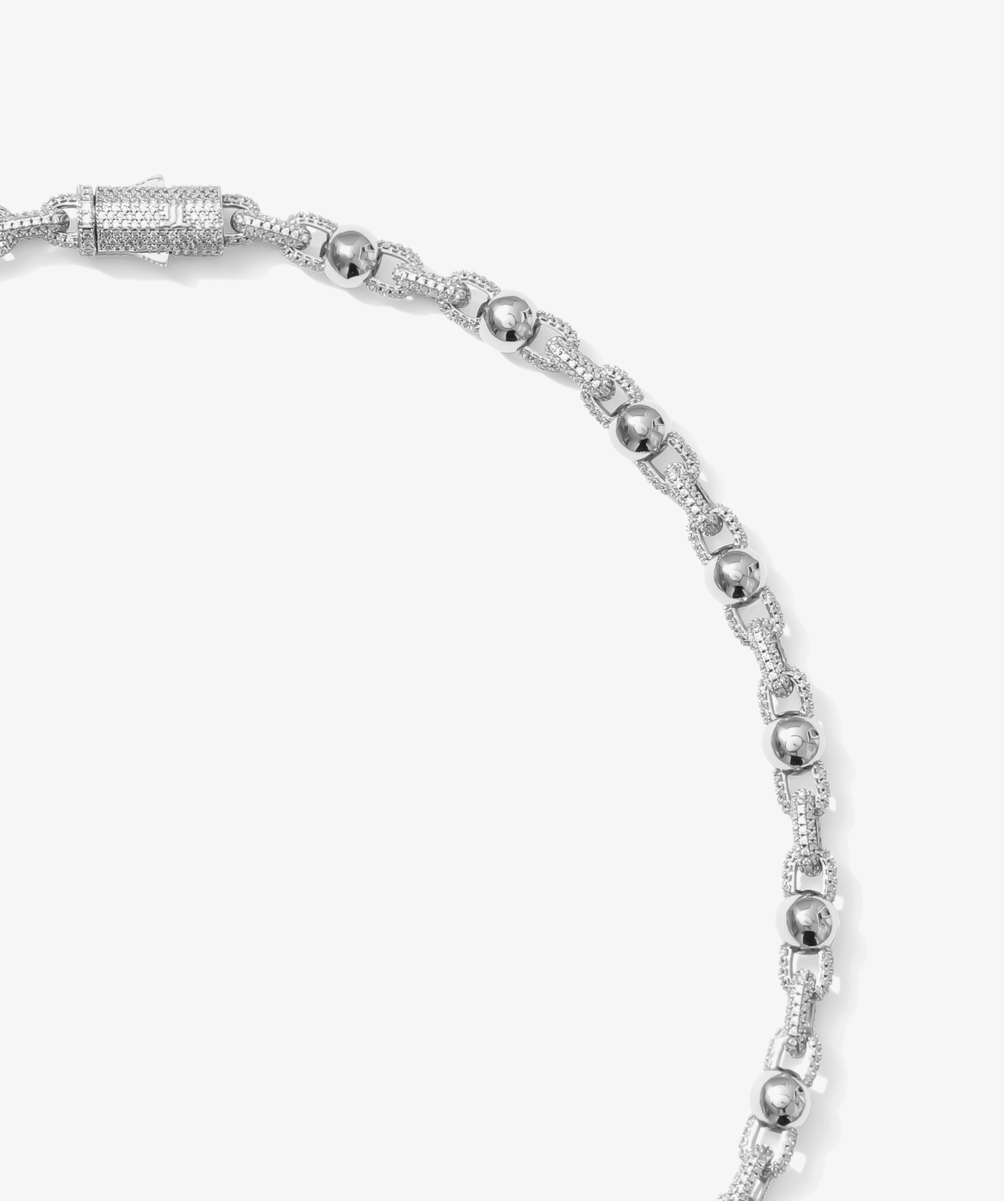 ICED London silver bracelet with pavé-linked segments and polished spherical beads, diamond-encrusted chain.