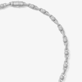 ICED London diamond tennis bracelet in white gold with pavé-set diamonds, close-up shot of linked, sparkling segments.
