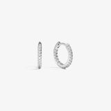 ICED London silver hoop earrings with pavé crystals along the outer edge, shown from front and side.
