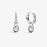 ICED London silver hoop earrings with pavé crystals and dangling crystal ball charms.