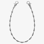 ICED London silver chain bracelet with bone-shaped links and dual lobster clasps, close-up product shot.