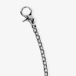 ICED London: close-up of a silver lobster clasp and chain bracelet on a white background.