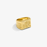 ICED London gold signet ring with an engraved floral panel, bold rectangular face, and ridged sides.