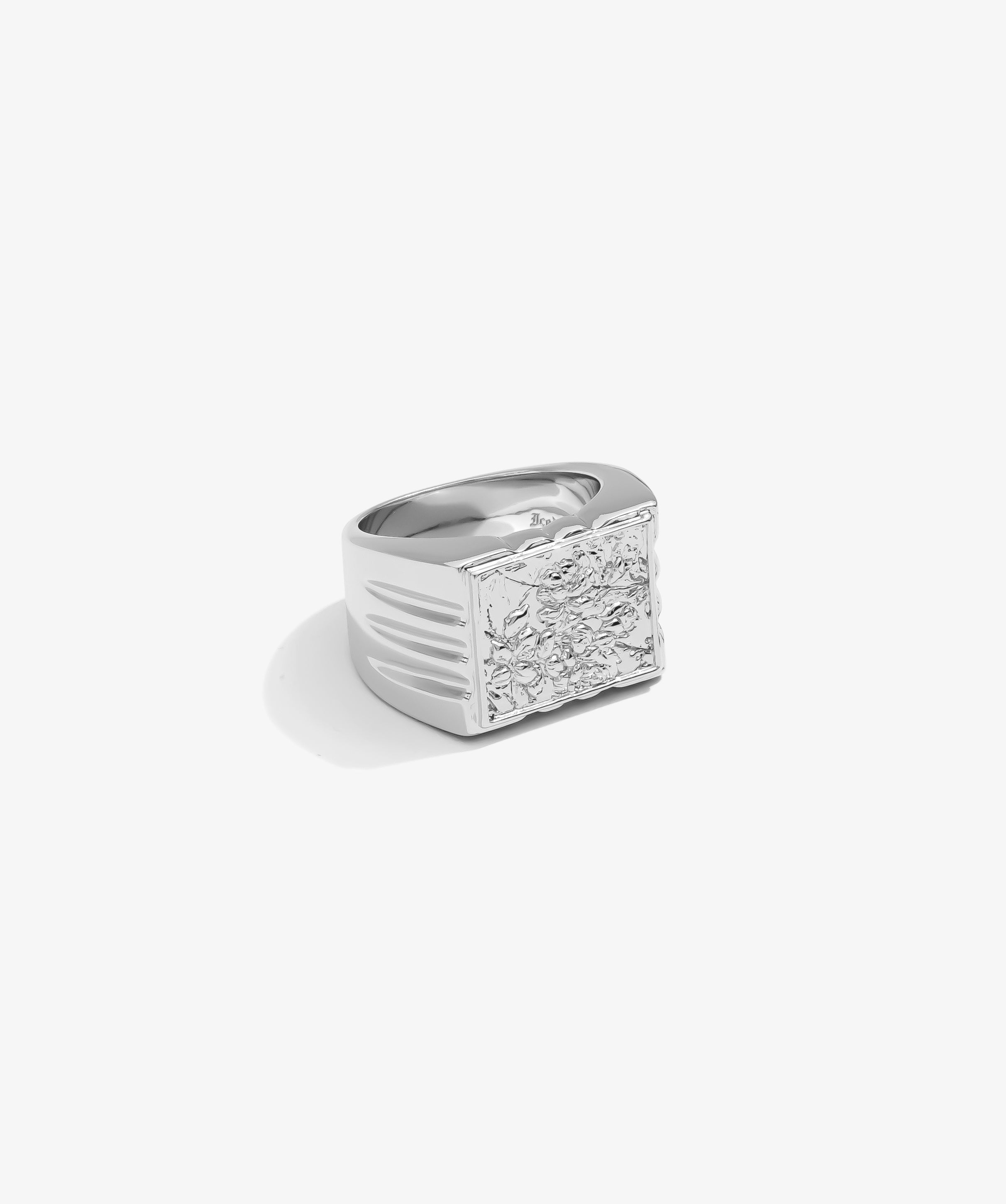 ICED London silver men's signet ring with a textured floral relief on a square face and bold wide band.