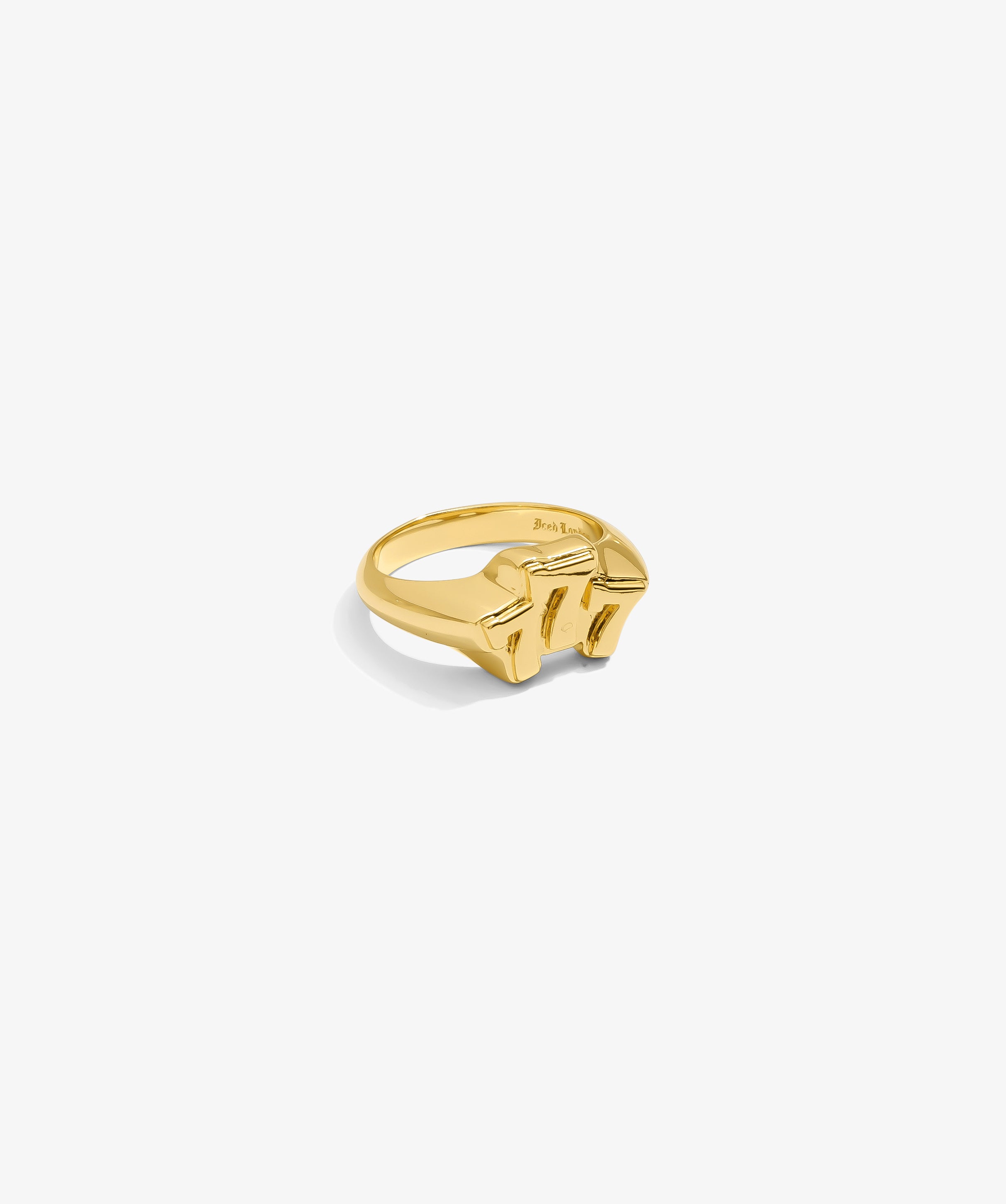 ICED London gold signet ring with a chunky geometric top, close-up on white background.