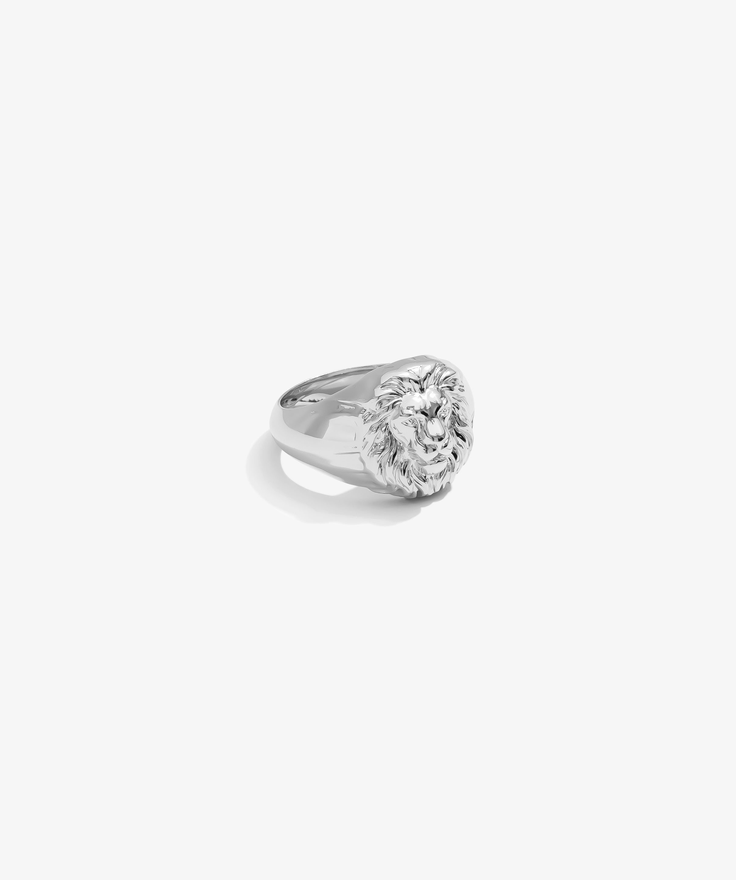 ICED London silver lion head signet ring with detailed mane and polished finish, angled side view.