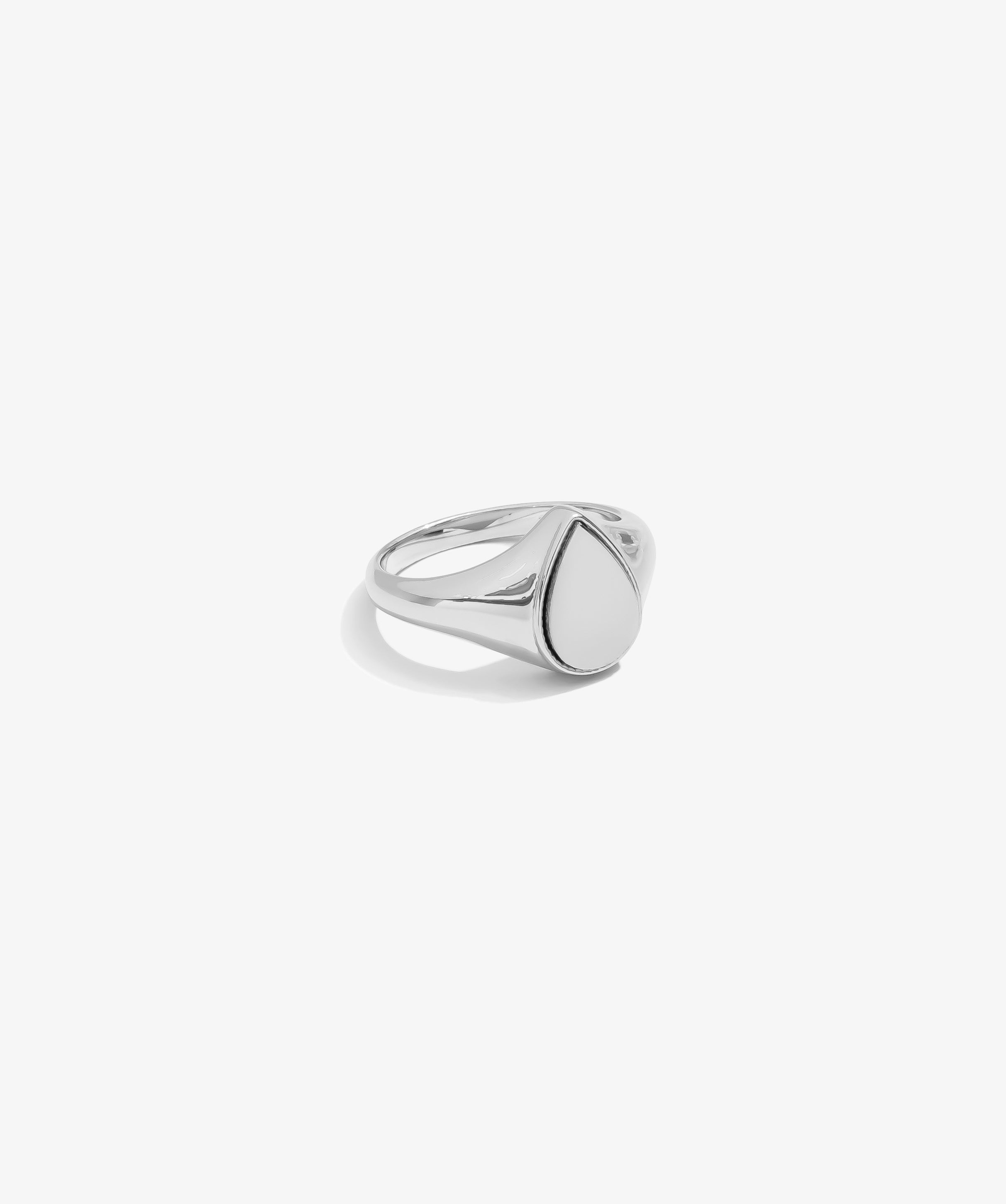 ICED London silver signet ring with a smooth oval bezel and sleek band.