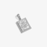 ICED London silver rectangular pendant with an engraved floral scene and decorative border, hanging from a polished bail.