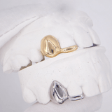 ICED London: gold and silver signet rings displayed on a dental plaster model for product photography.